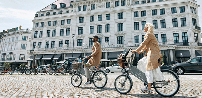 Street Level Hotel Facade People on Bikes